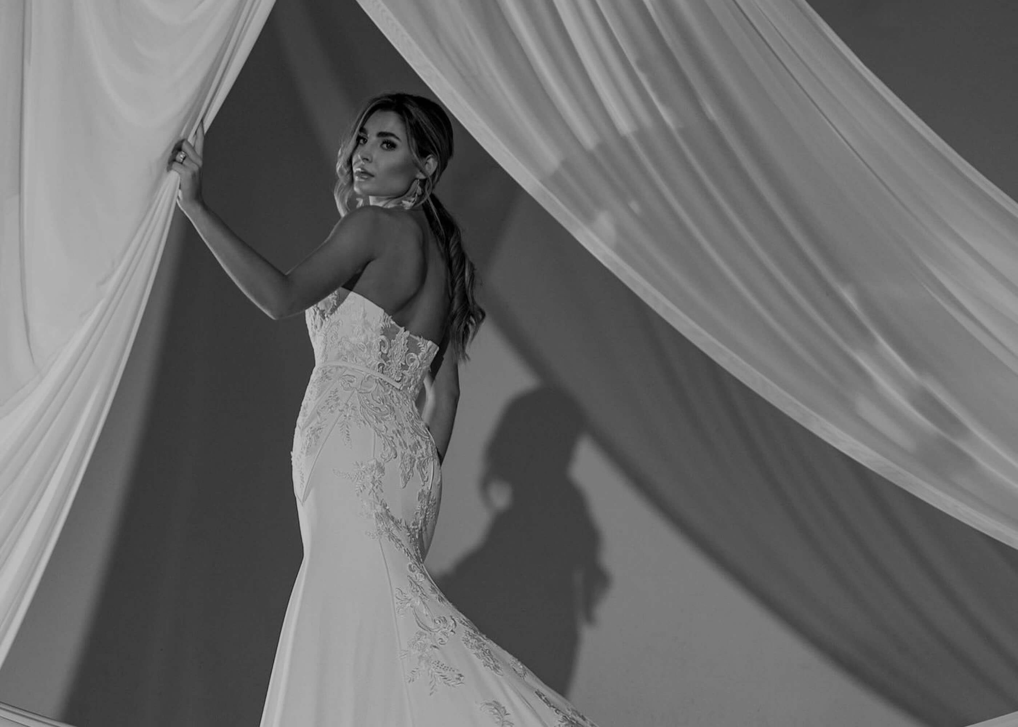 Model wearing a white gown