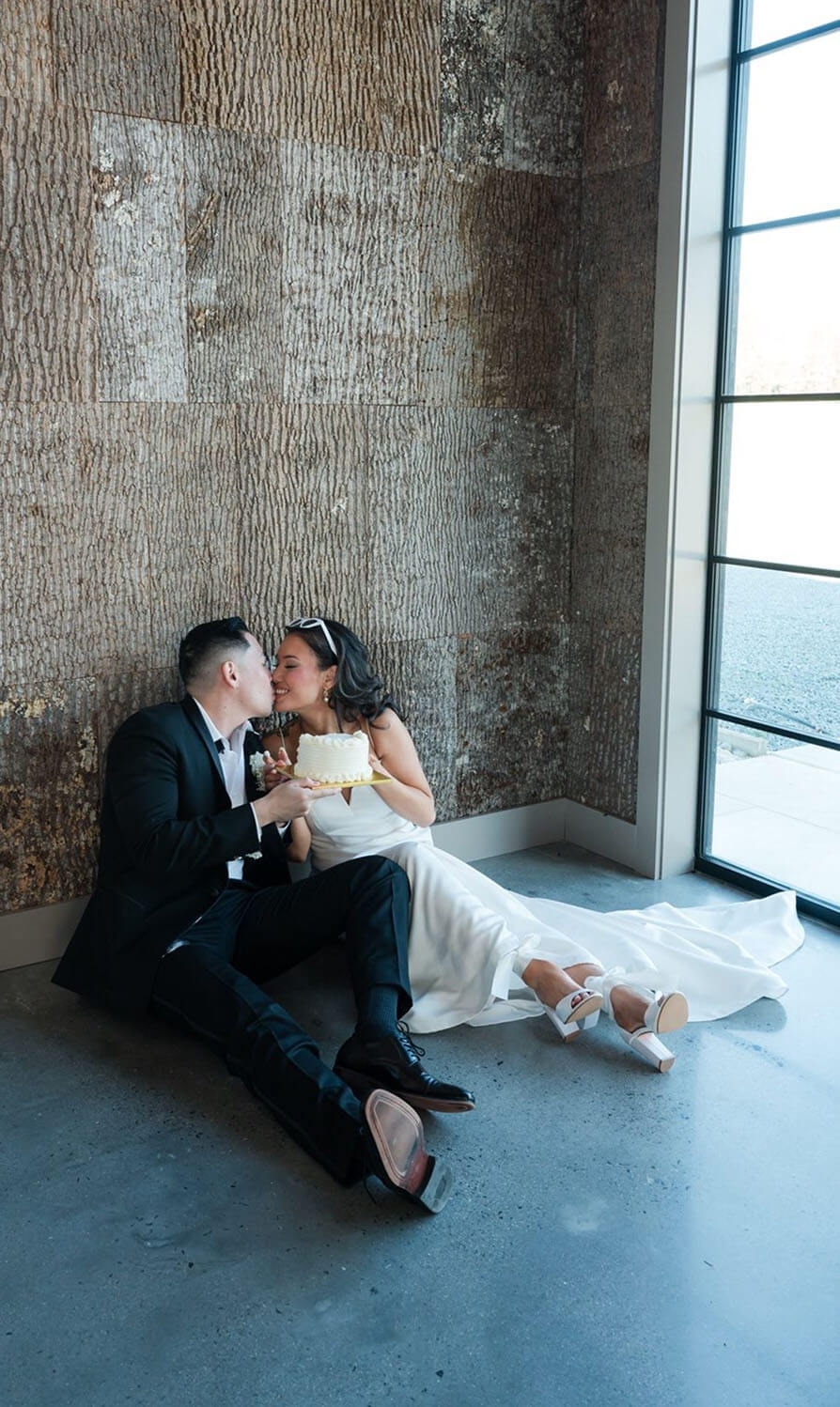Сouple wearing a white gown and a black suit
