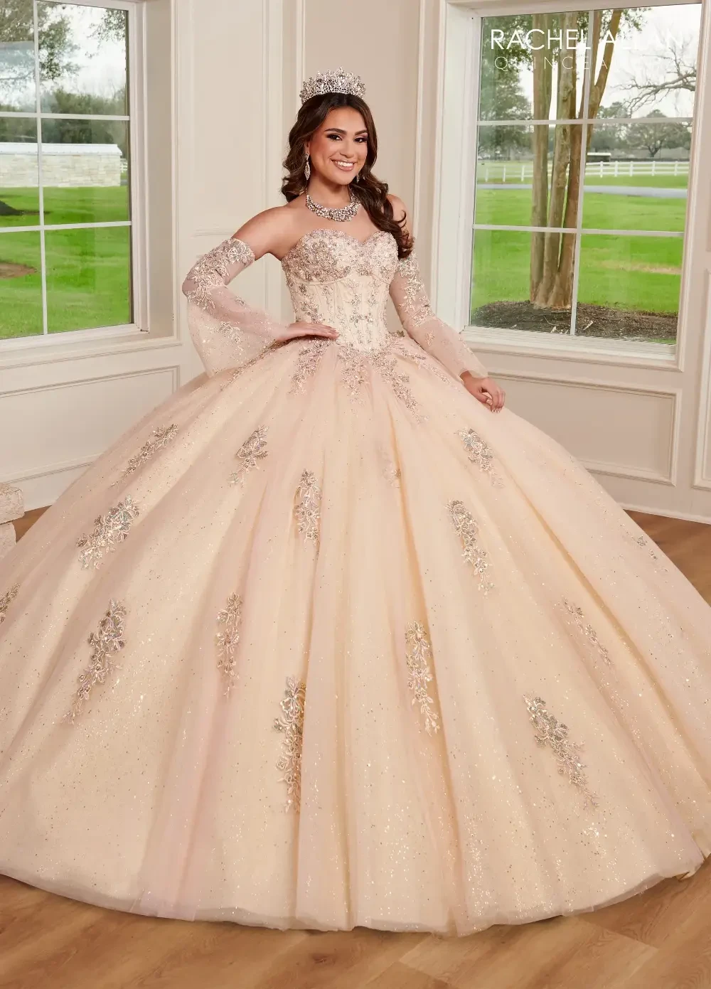 model is wearing a cream colored quince gown