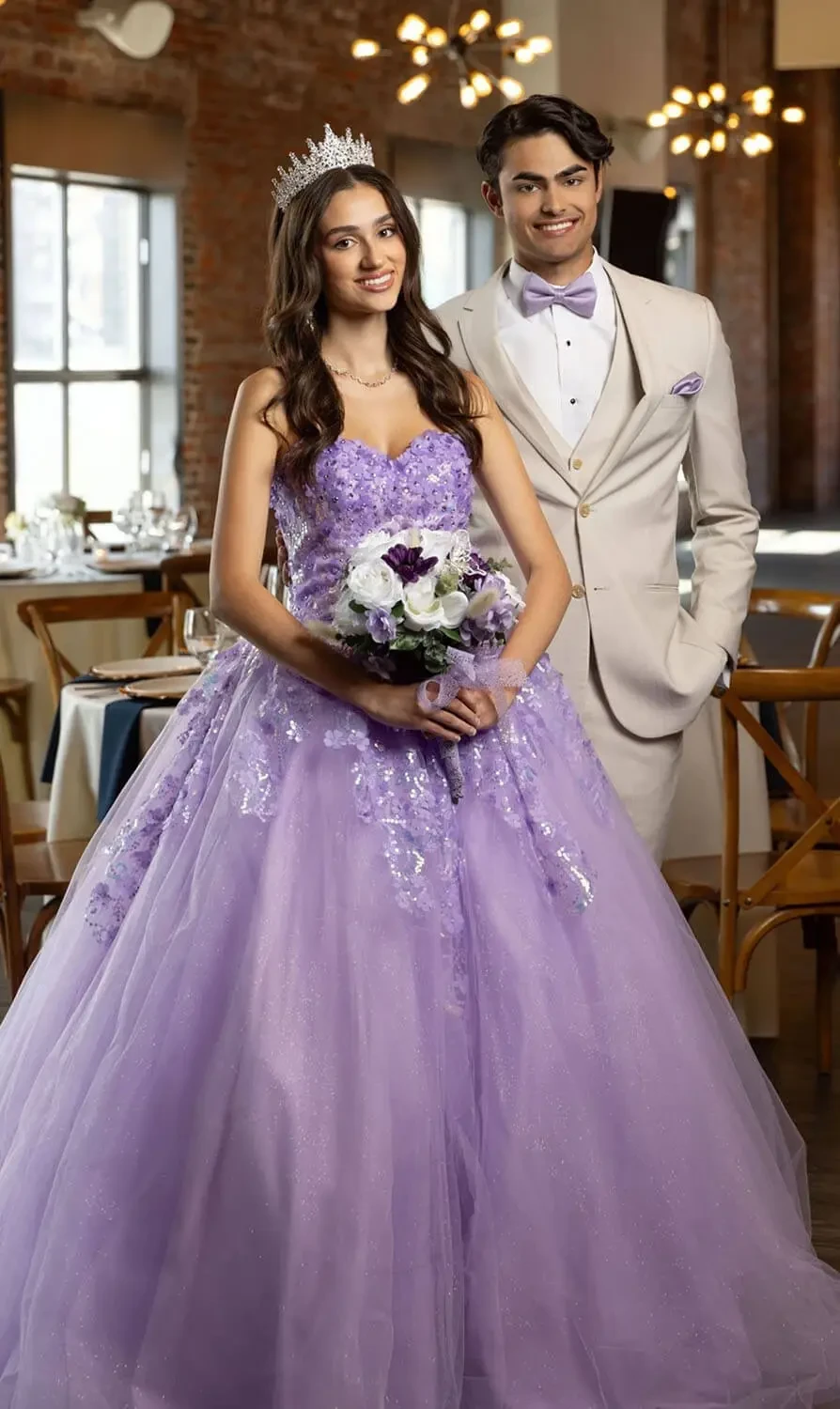 Сouple wearing a pink gown and a white suit
